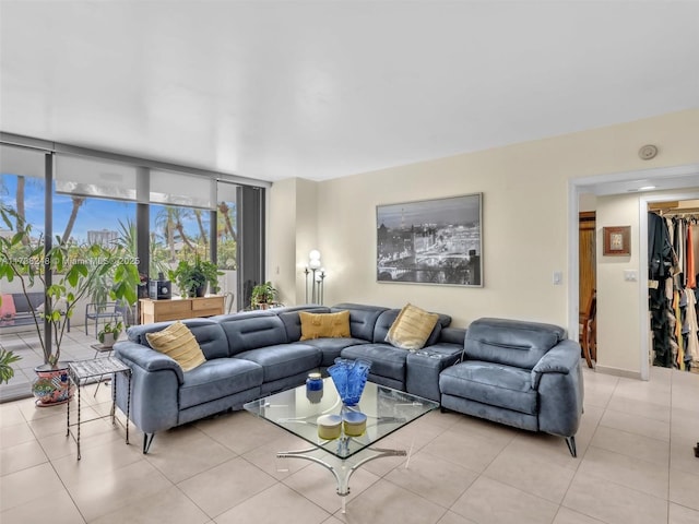 living room featuring baseboards and light tile patterned flooring