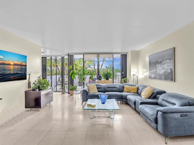 living area featuring floor to ceiling windows and light tile patterned floors