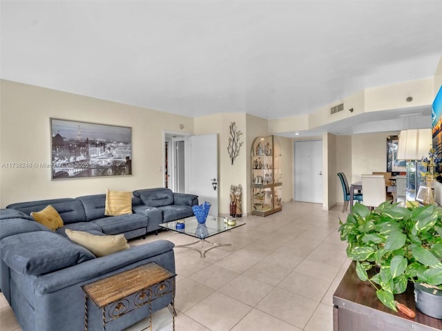 living room with light tile patterned floors and visible vents