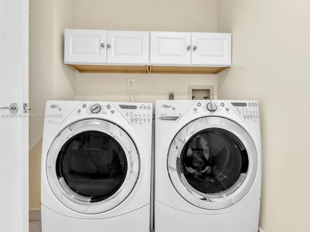 laundry area with cabinet space and washing machine and dryer