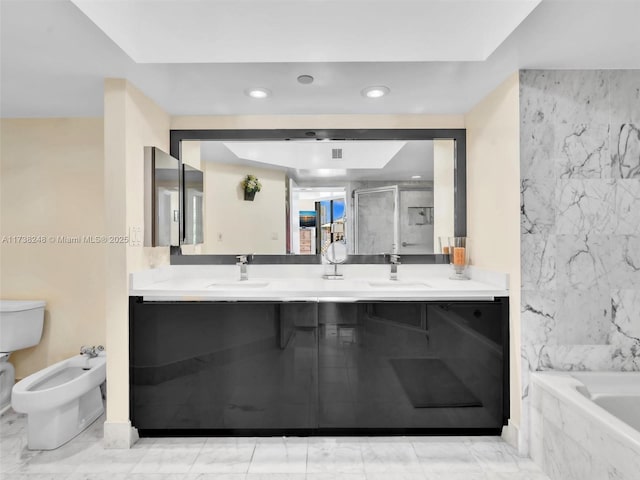 full bathroom featuring a garden tub, marble finish floor, a sink, and a marble finish shower