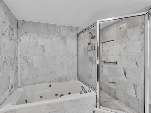 full bath featuring a jetted tub and a marble finish shower