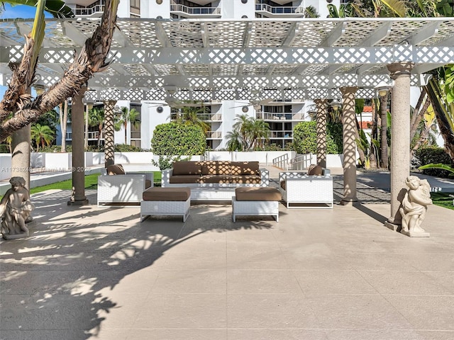 view of patio featuring an outdoor hangout area and a pergola