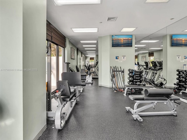 workout area with visible vents and baseboards