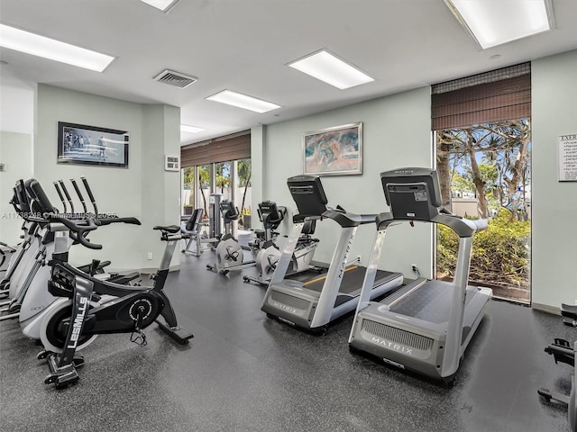 exercise room featuring baseboards and visible vents