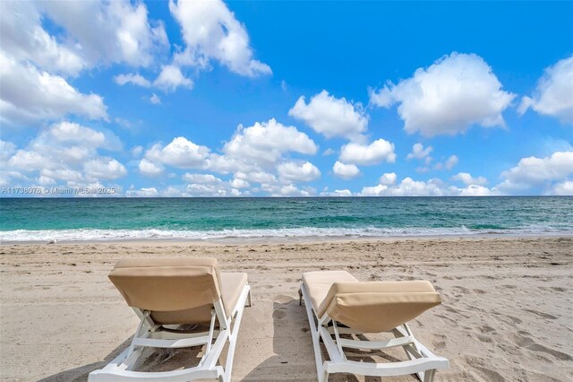 property view of water featuring a beach view