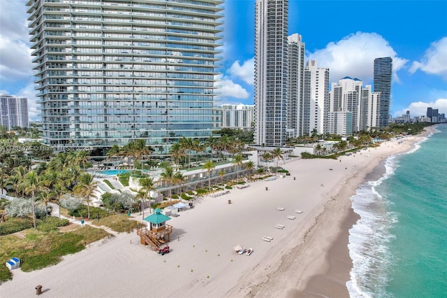 exterior space featuring a beach view and a water view