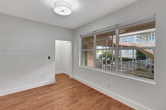 spare room with hardwood / wood-style flooring