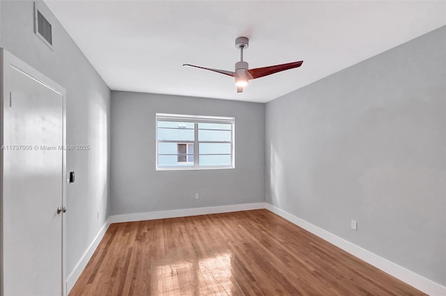 unfurnished room with wood-type flooring and ceiling fan