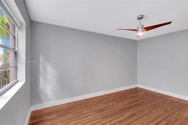 unfurnished room with wood-type flooring and ceiling fan