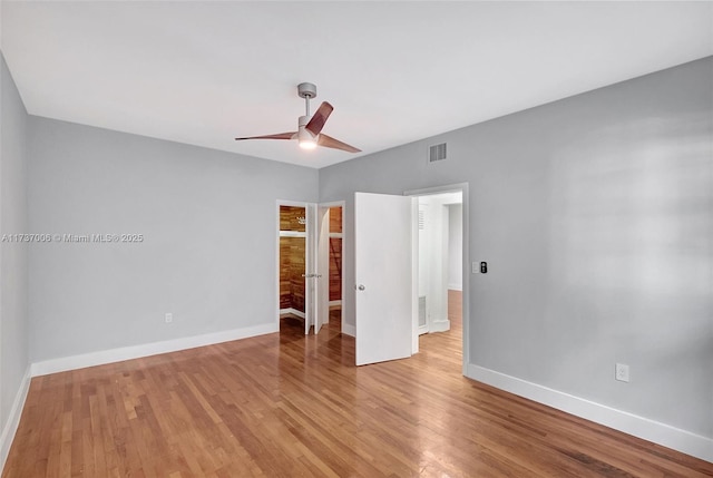 unfurnished bedroom with ceiling fan and light hardwood / wood-style floors