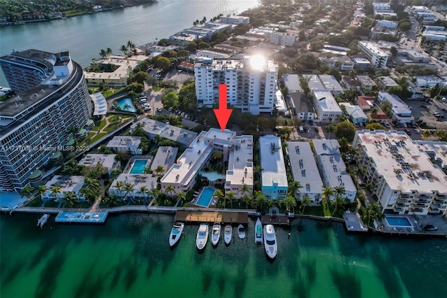 birds eye view of property with a water view