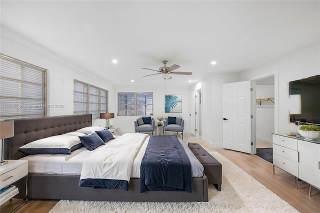 bedroom featuring ceiling fan, wood finished floors, and recessed lighting