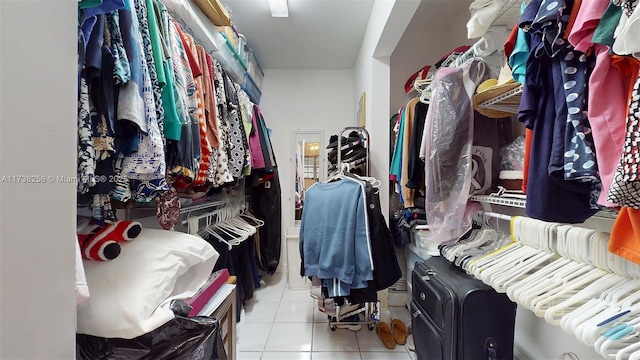 walk in closet featuring light tile patterned floors