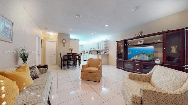 tiled living room with a textured ceiling