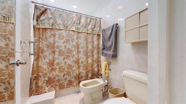 bathroom featuring tile patterned flooring, a bidet, walk in shower, and toilet