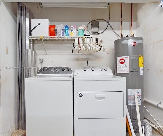 washroom featuring water heater and washing machine and clothes dryer