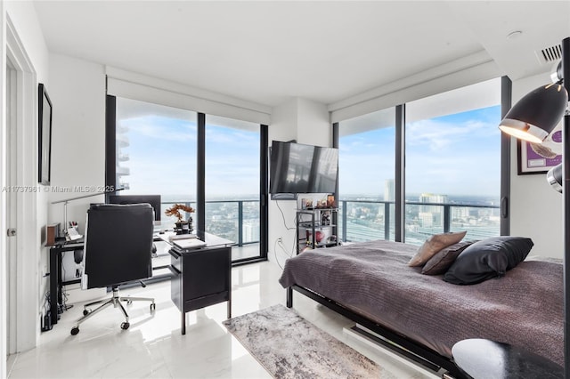 bedroom with a wall of windows