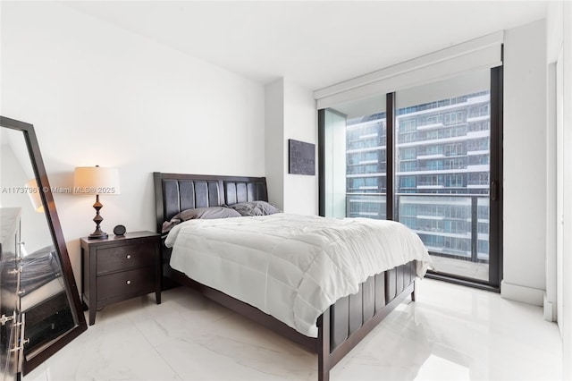 bedroom featuring access to exterior and expansive windows