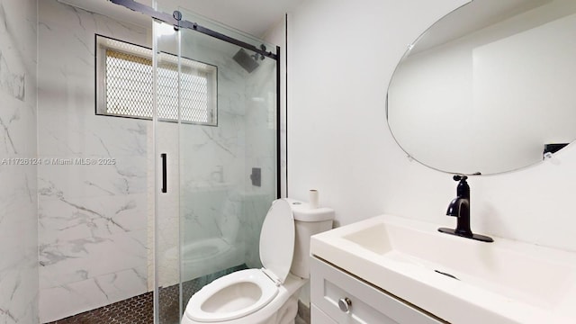 bathroom with vanity, toilet, and a shower with shower door