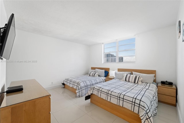 bedroom featuring baseboards