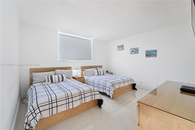 bedroom featuring baseboards