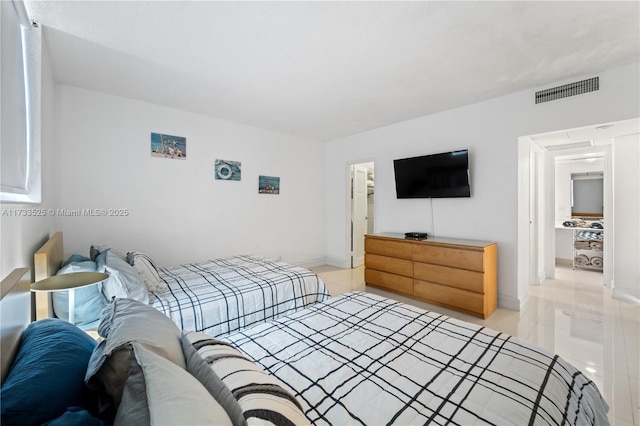 bedroom with baseboards, visible vents, and light tile patterned flooring