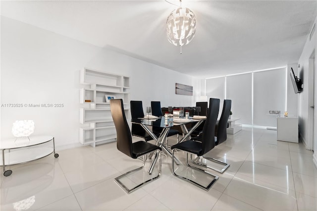 dining space with light tile patterned floors and baseboards