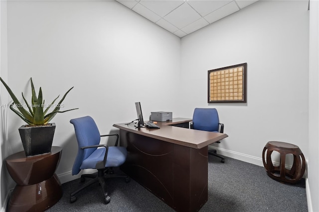 carpeted home office featuring a paneled ceiling and baseboards