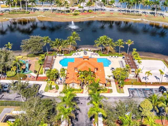 birds eye view of property with a water view