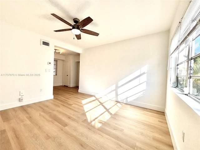 unfurnished room featuring ceiling fan and light hardwood / wood-style flooring