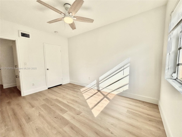 unfurnished bedroom featuring ceiling fan and light hardwood / wood-style flooring