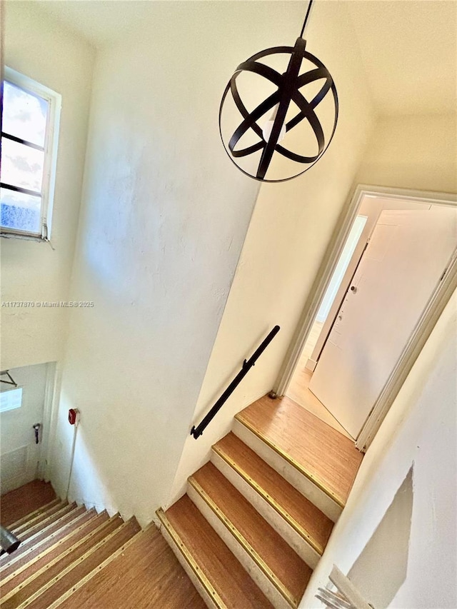 stairway featuring hardwood / wood-style floors