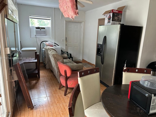 kitchen with cooling unit, stainless steel fridge with ice dispenser, and light hardwood / wood-style flooring