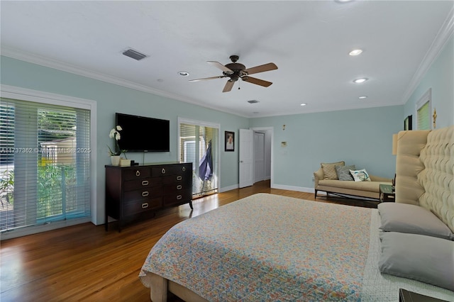 bedroom with multiple windows, crown molding, and dark hardwood / wood-style flooring