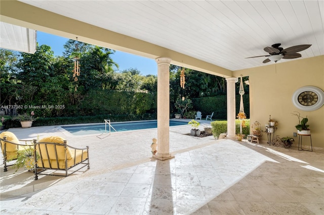 view of pool featuring ceiling fan and a patio area