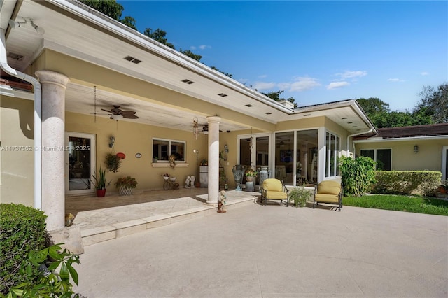 rear view of house featuring a patio area and ceiling fan