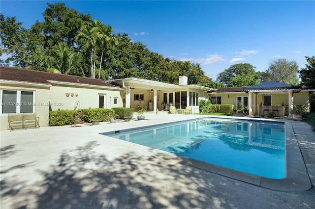 view of swimming pool featuring a patio area