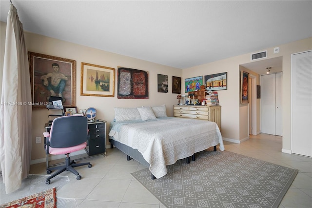 bedroom with light tile patterned floors