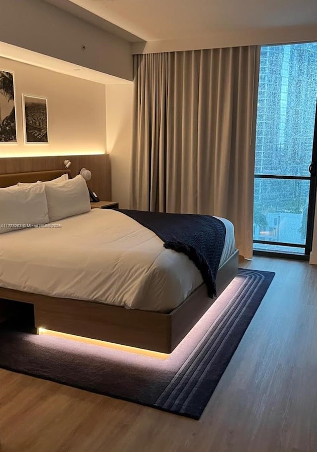 bedroom with wood-type flooring