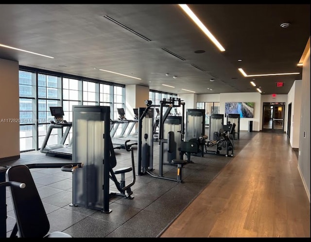 workout area featuring floor to ceiling windows