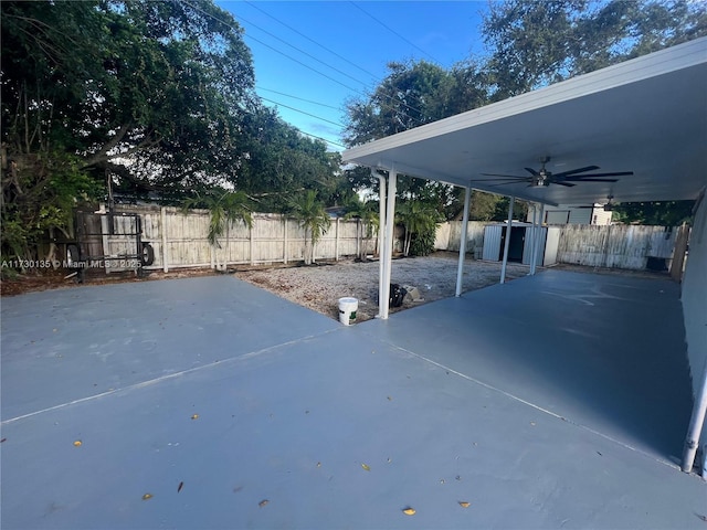 view of patio featuring ceiling fan and a storage unit