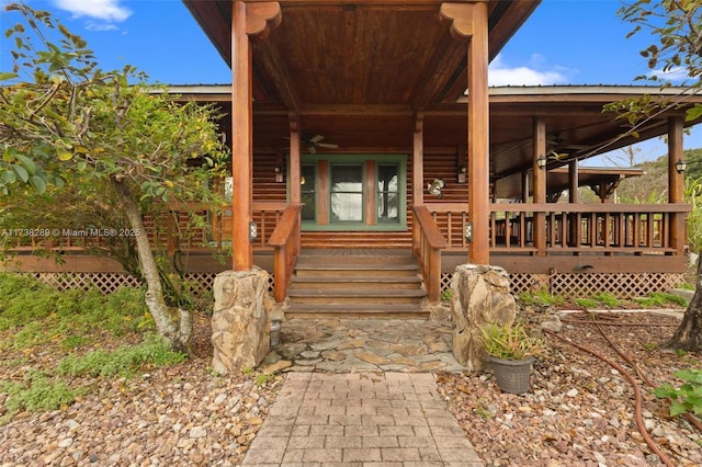 view of exterior entry featuring a porch