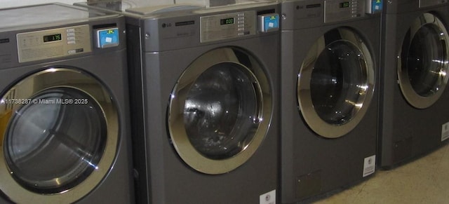 laundry room with independent washer and dryer