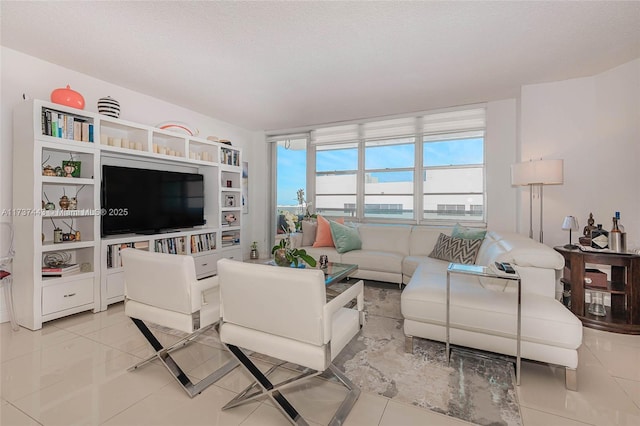 tiled living room with a textured ceiling