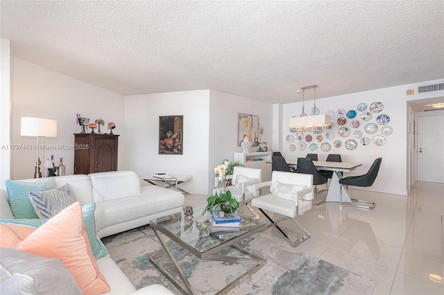 living room with light tile patterned floors and a textured ceiling