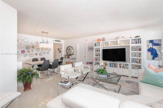 tiled living room featuring a textured ceiling