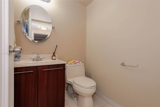 bathroom with tile patterned floors, vanity, and toilet