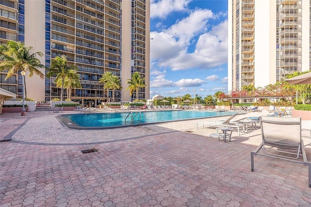 community pool featuring a patio area