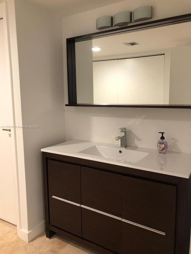 bathroom featuring visible vents and vanity